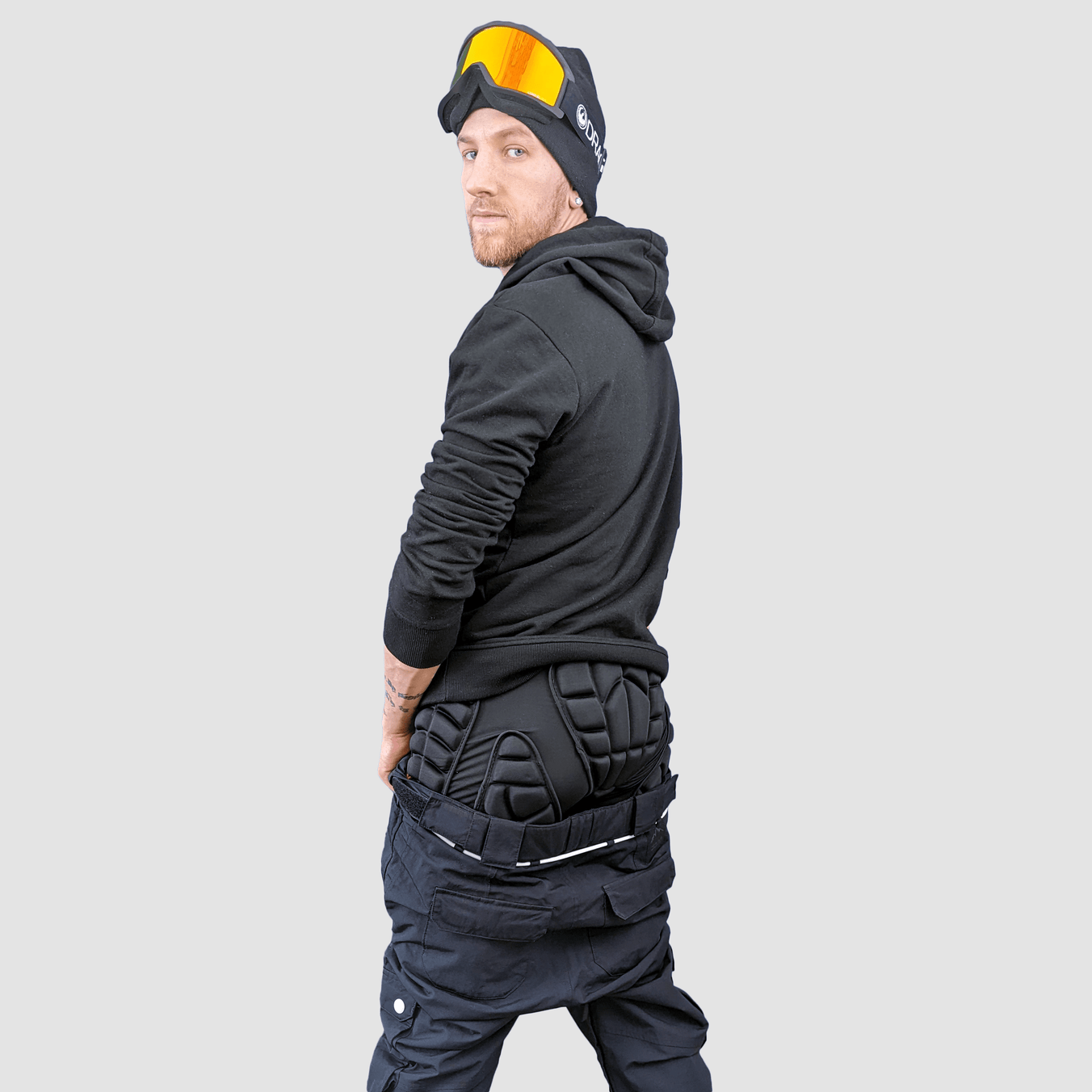 Angled shot of Snowboarder wearing impact shorts